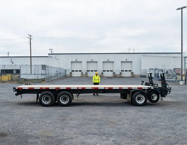 Custom flatbed trailer at a commercial loading yard